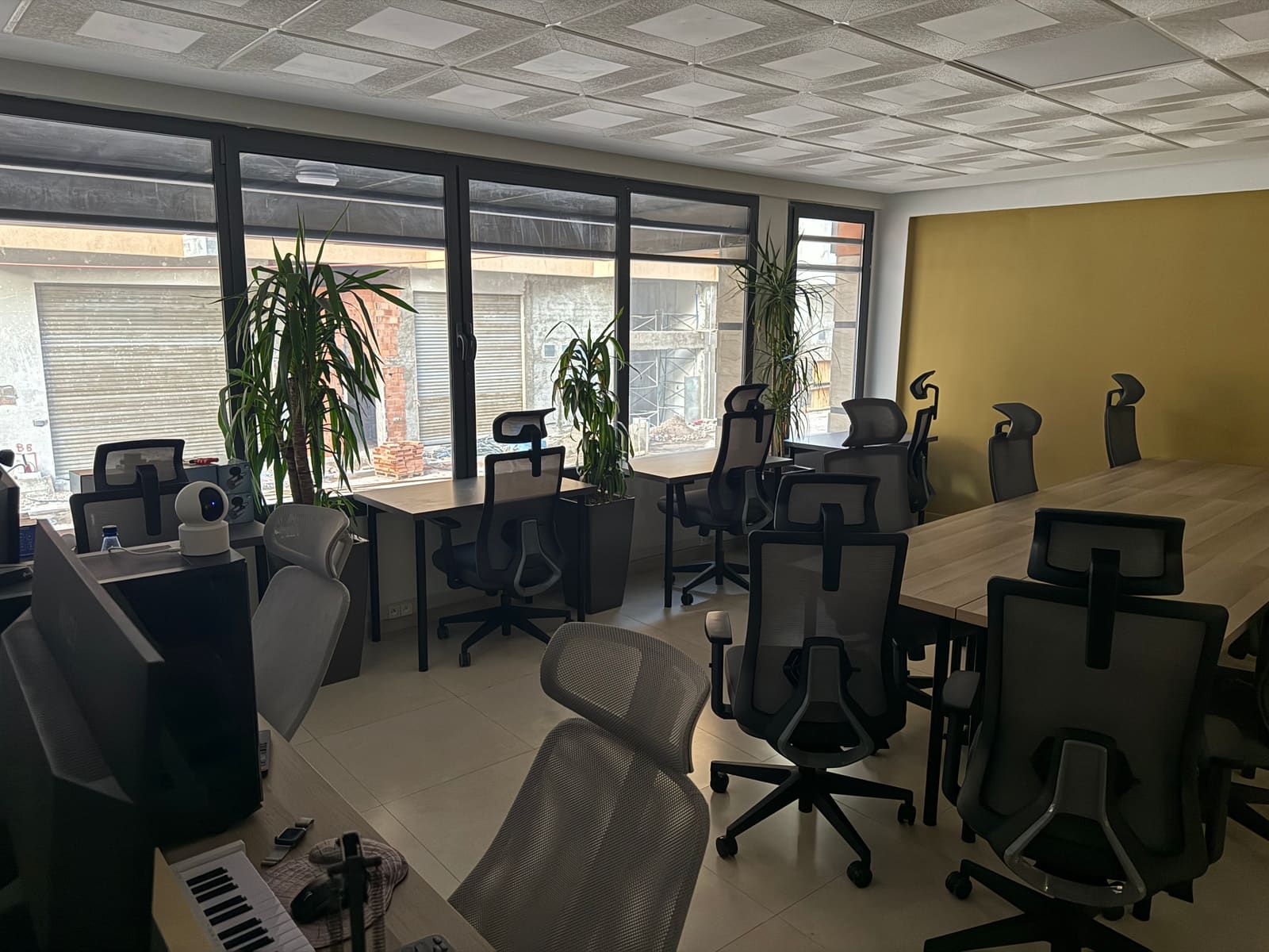 MoCal Alliance coworking floor in Marrakech — ergonomic Herman Miller chairs, natural light, plants, WiFi 7
